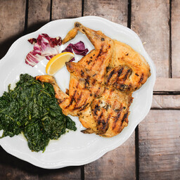 Galletto al limone grigliato con patate al forno
