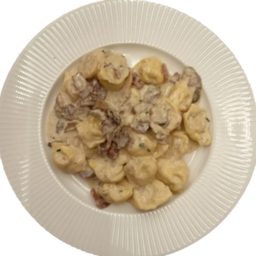 CAPPELLETTI CON CREMA DI TARTUFO PROSCIUTTO CRUDO E PORCINI